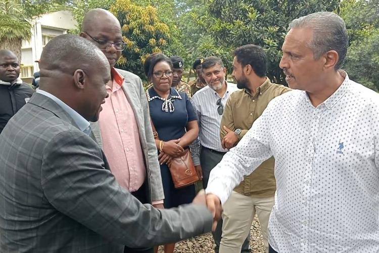 Hon. Jared Kopiyo, former chairman of the Board of Directors shakes hands with the Managing Director and Founder of Busia Sugar Ltd, Mr. Ali Taib, at SonySugar Company 2025 Ltd during the takeover on 10th May, 2025 in Awendo.